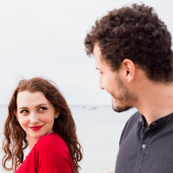 Happy woman with a man on the seashore