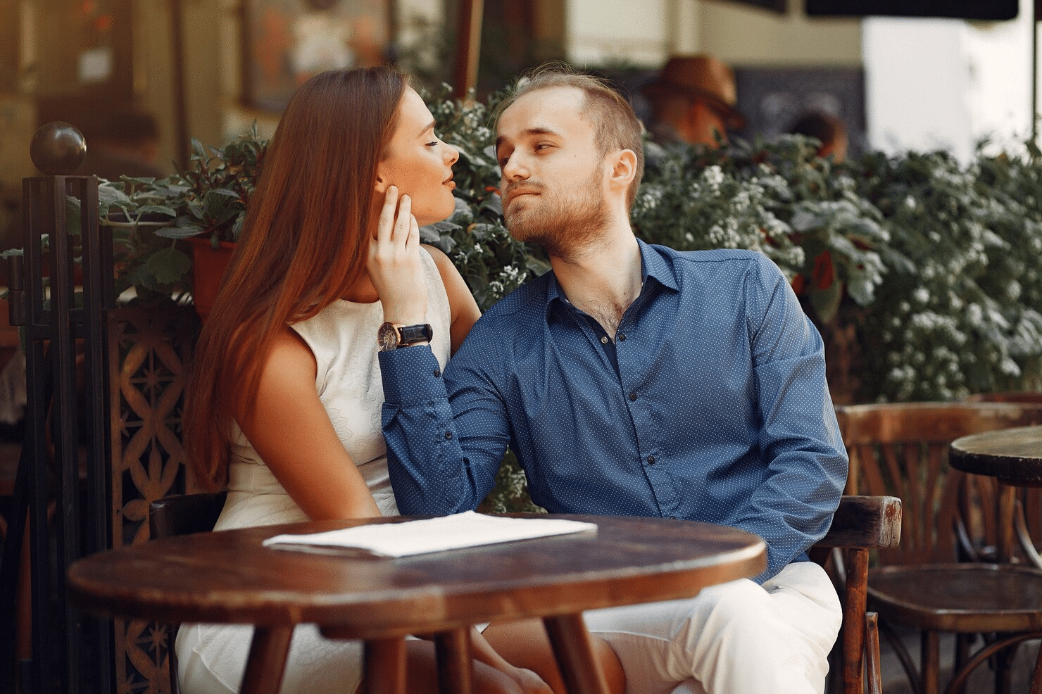 A man holding a woman’s face