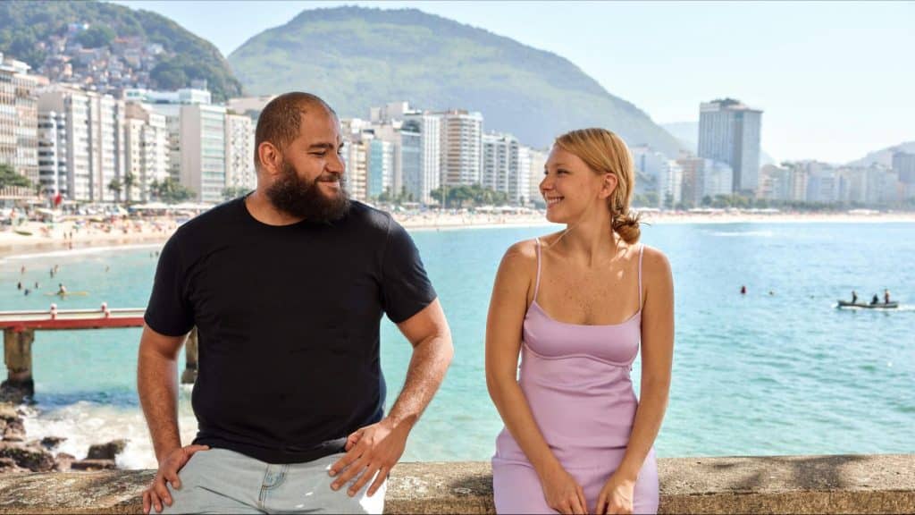 A man and woman smiling at each other
