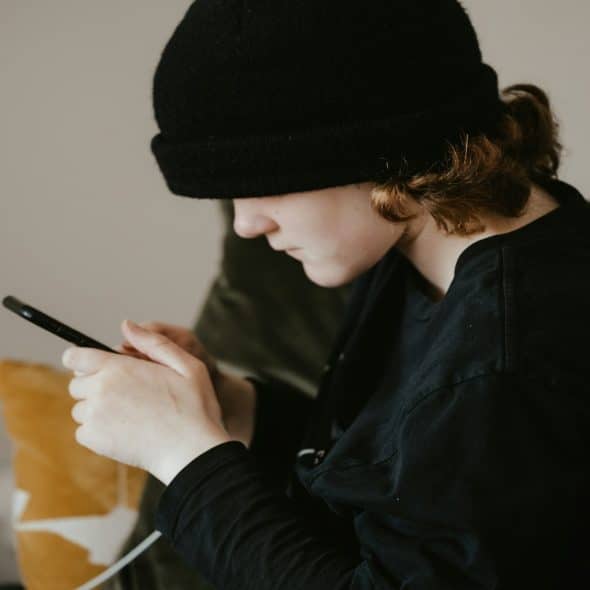 person texting on phone
