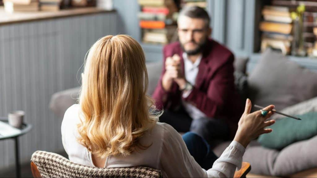 Woman talking to a man