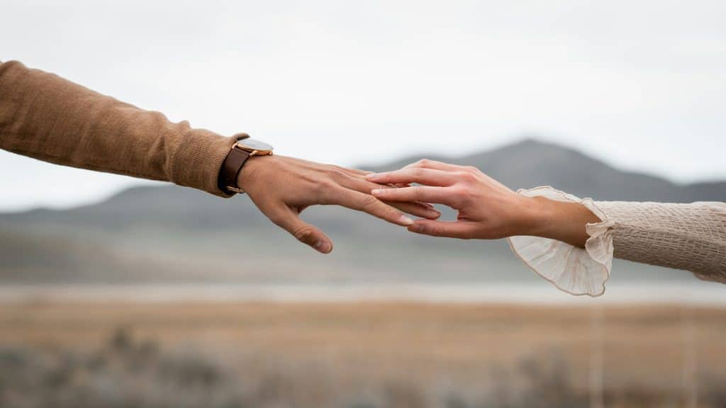 couple holding hands outdoors