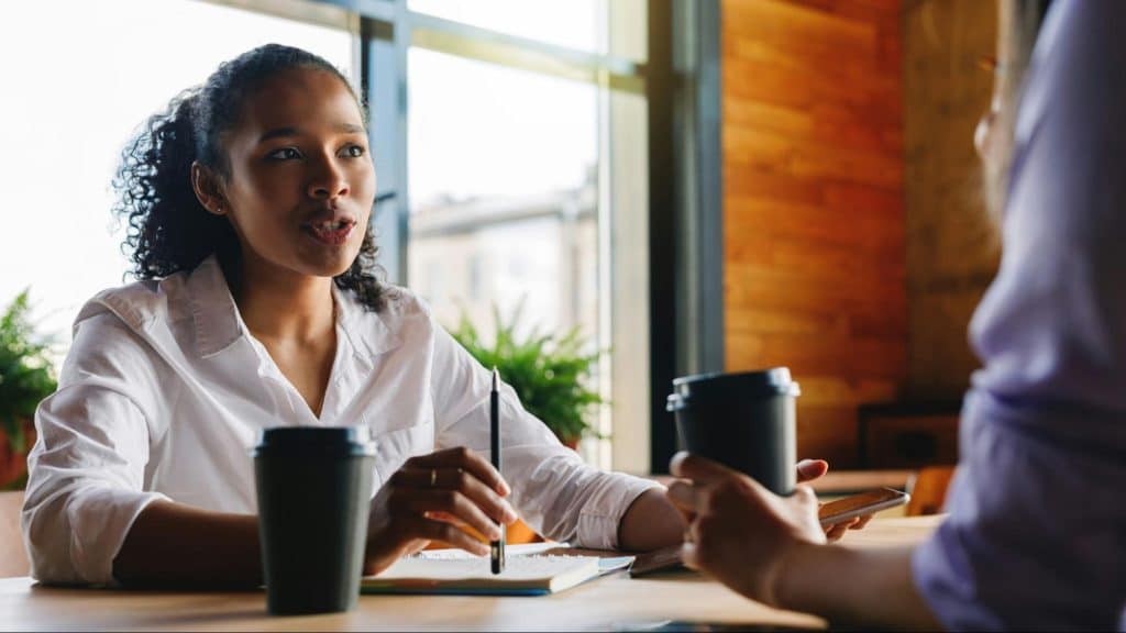 Woman talking to a man
