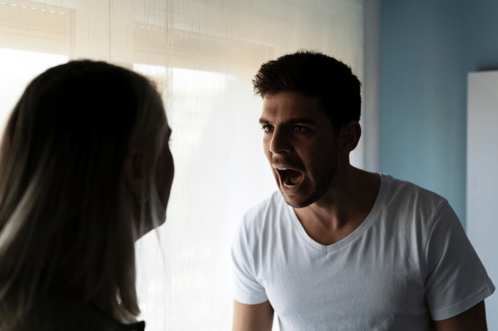 A man shouting to a woman