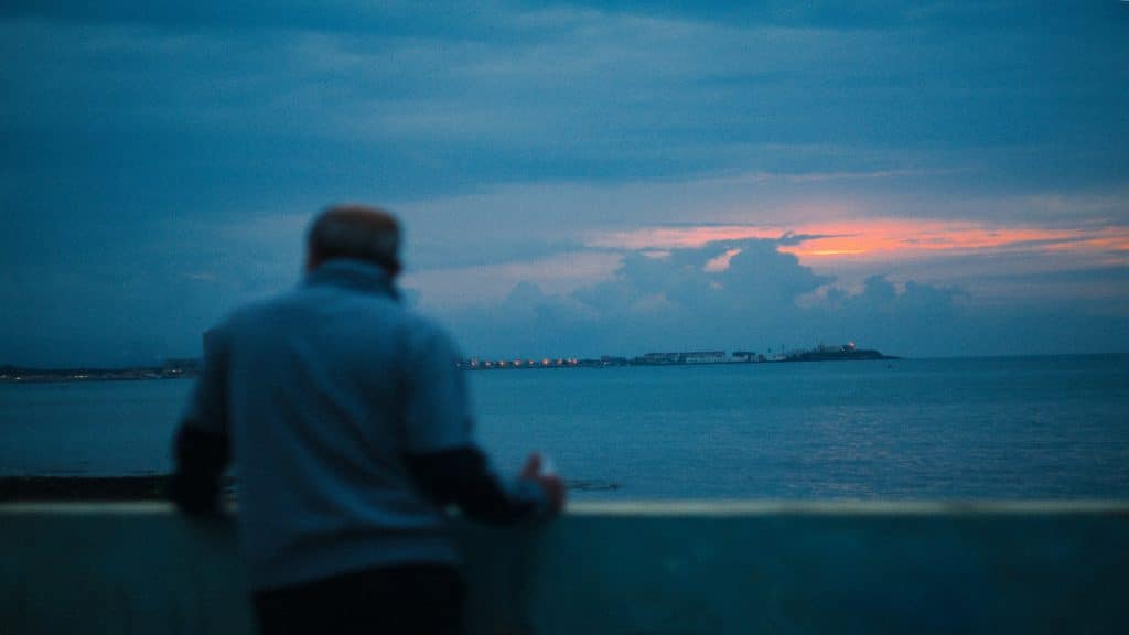 man looking toward horizon