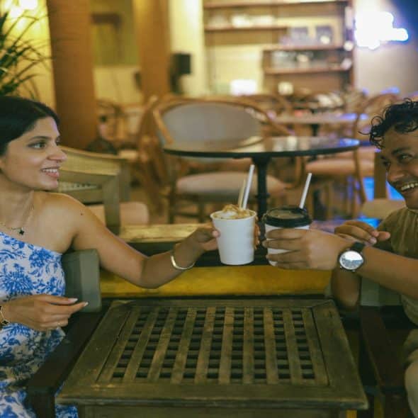 couple talking comfortably at café table