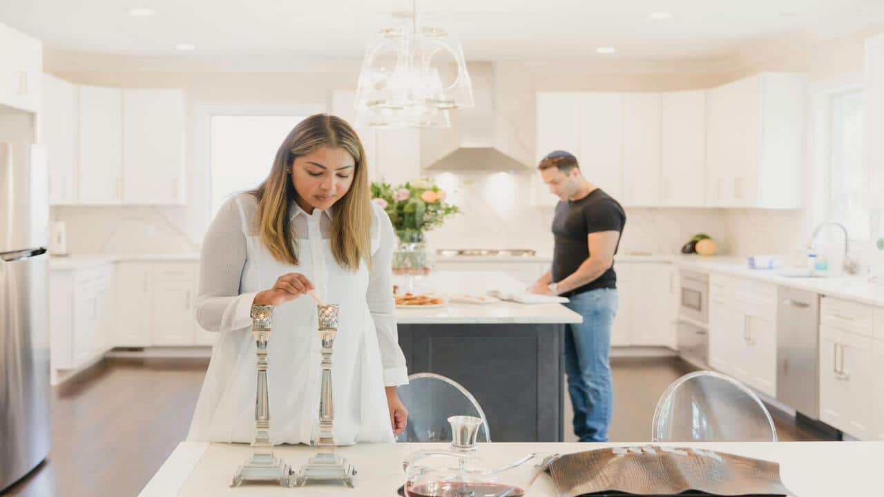 A couple busy at home
