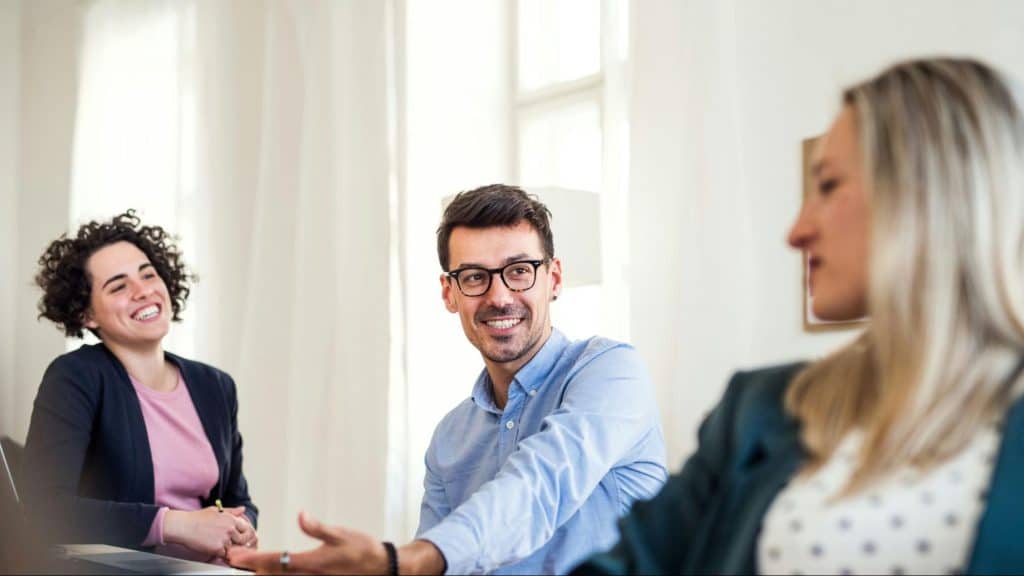A man receiving a compliment from a women