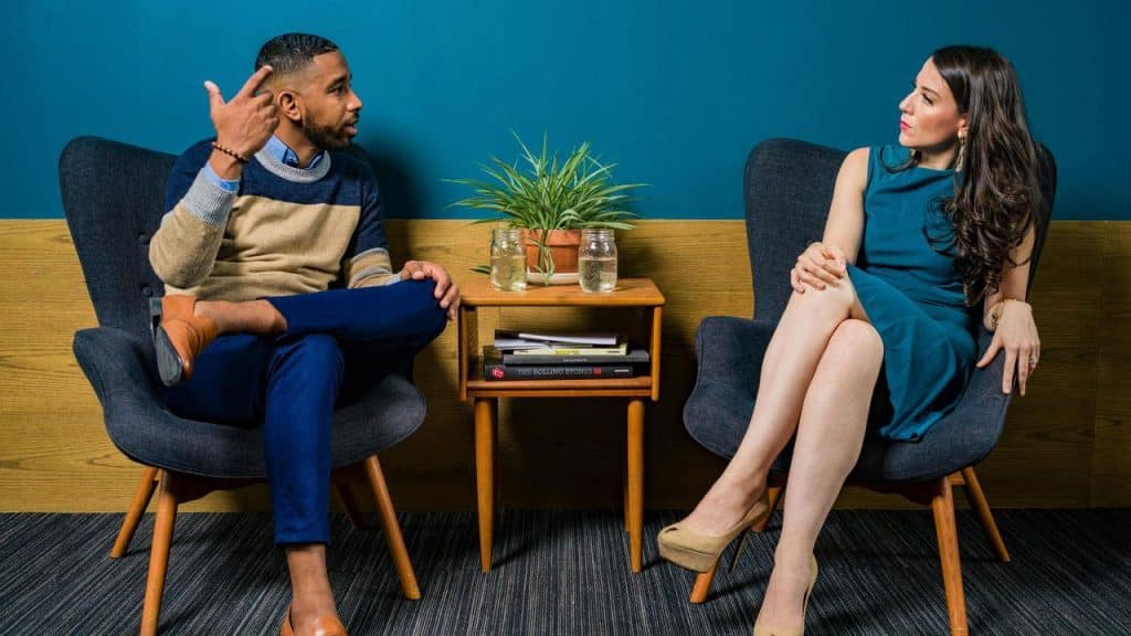 A man and woman sitting in chairs