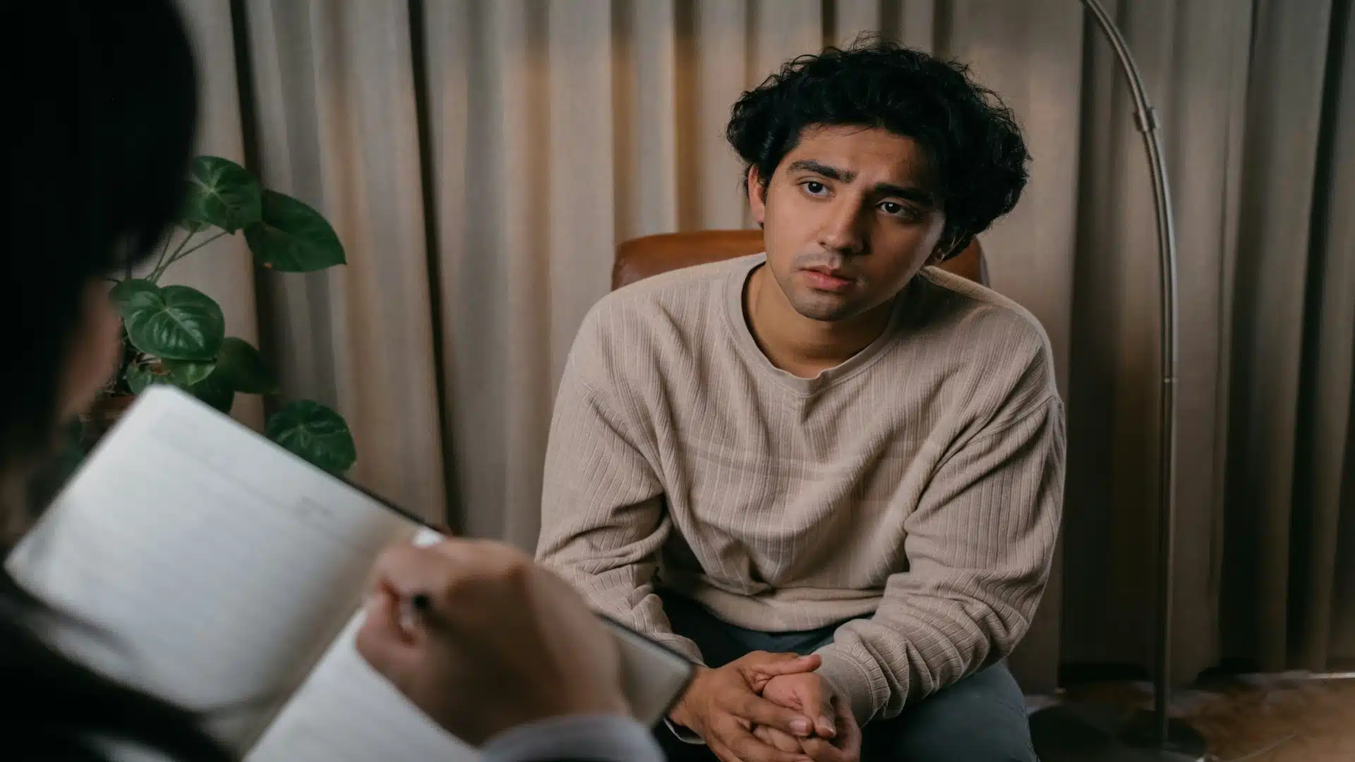 man listening attentively during conversation