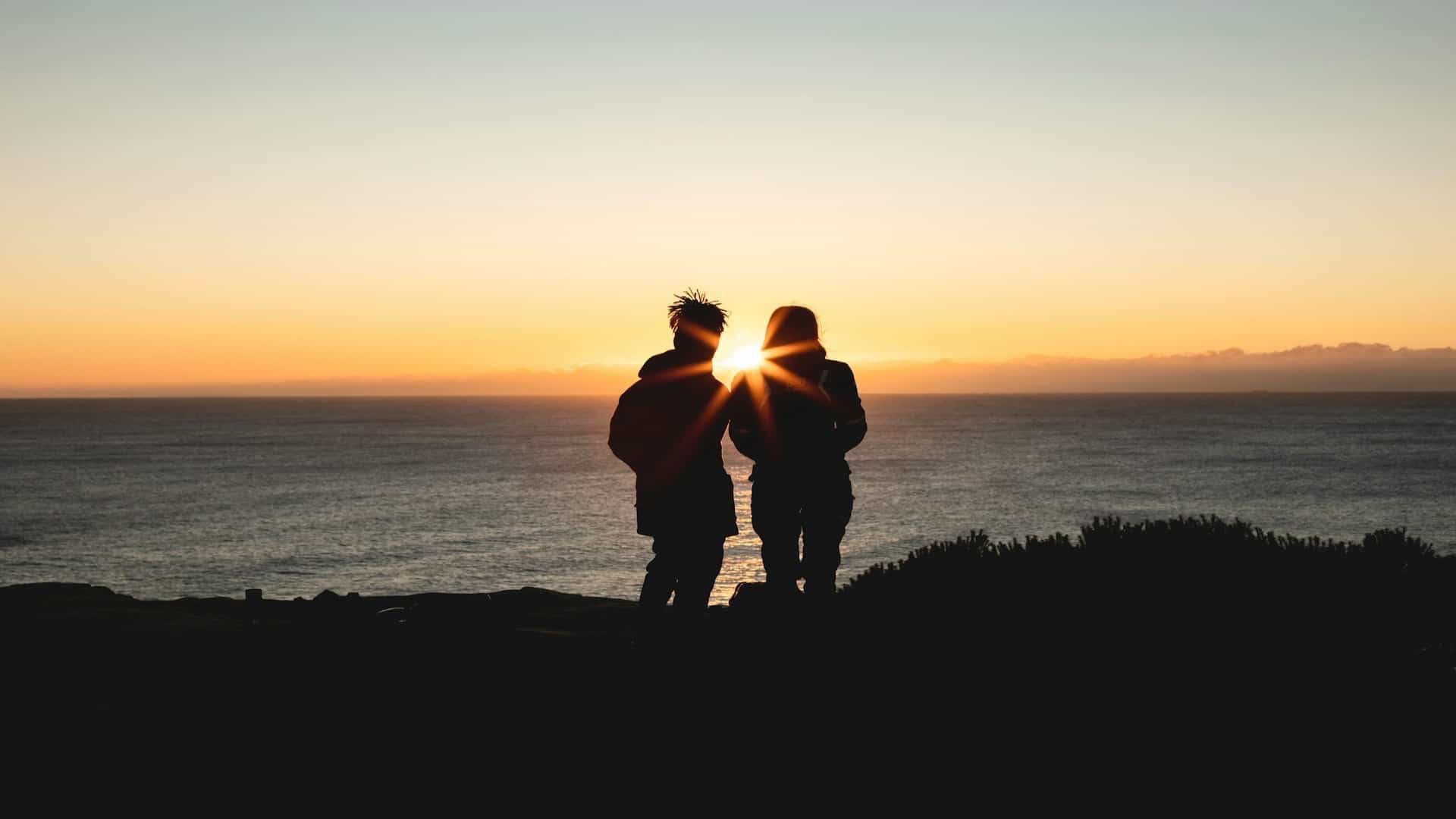 couple watching sunset together