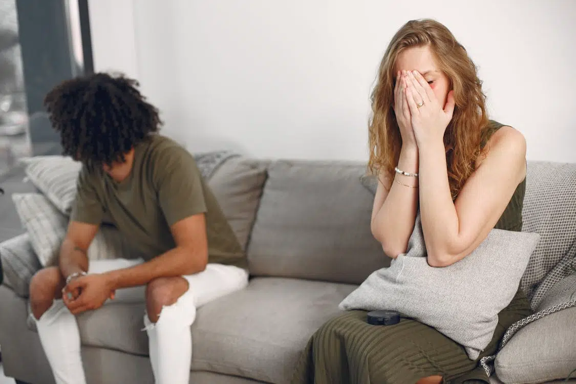 A Distant Couple Sitting on a Sofa