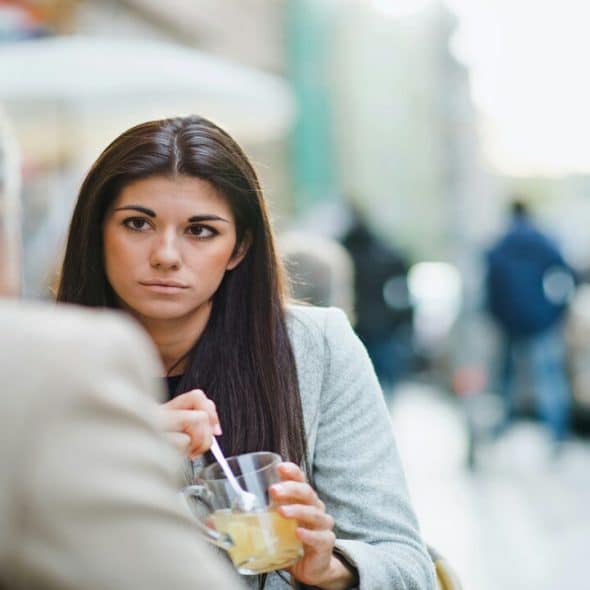 A woman listening to a man talking