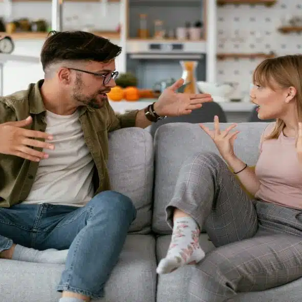 A couple fighting in the living room