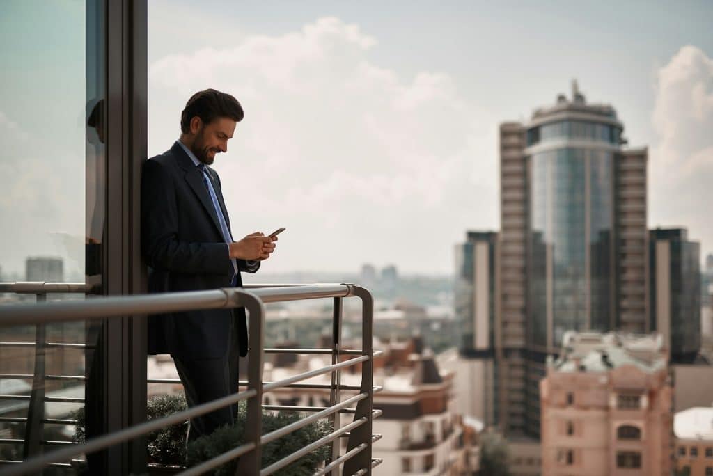 man texting smiling