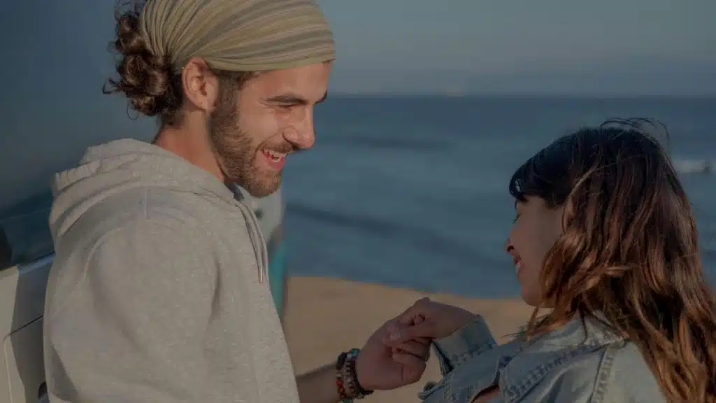 A smiling couple holding hands