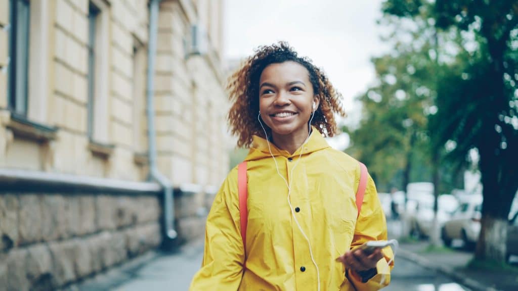 woman walking confidently outdoors