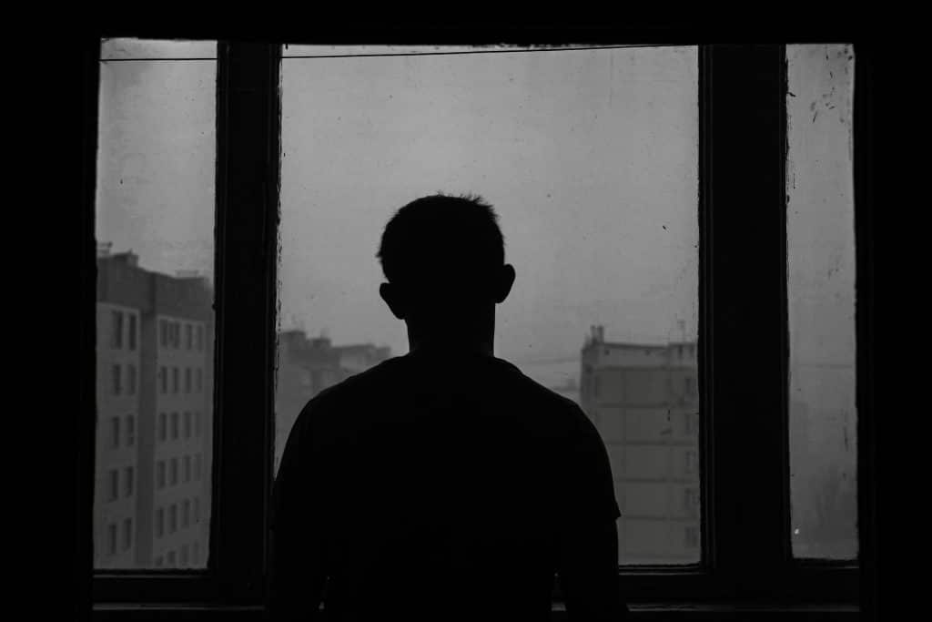man thoughtful window