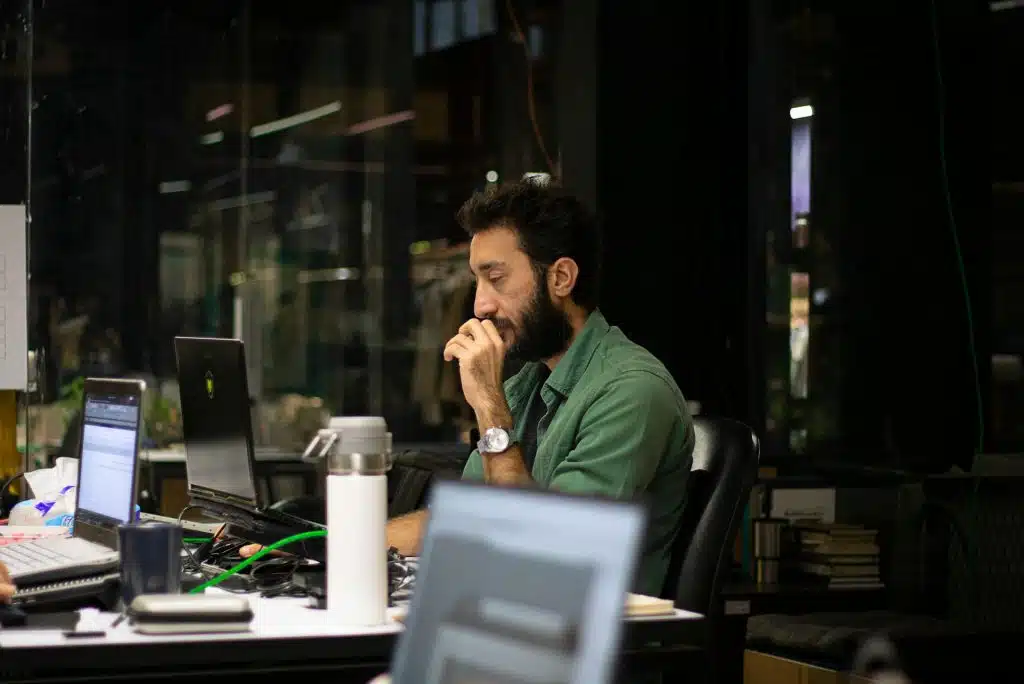 man working late office