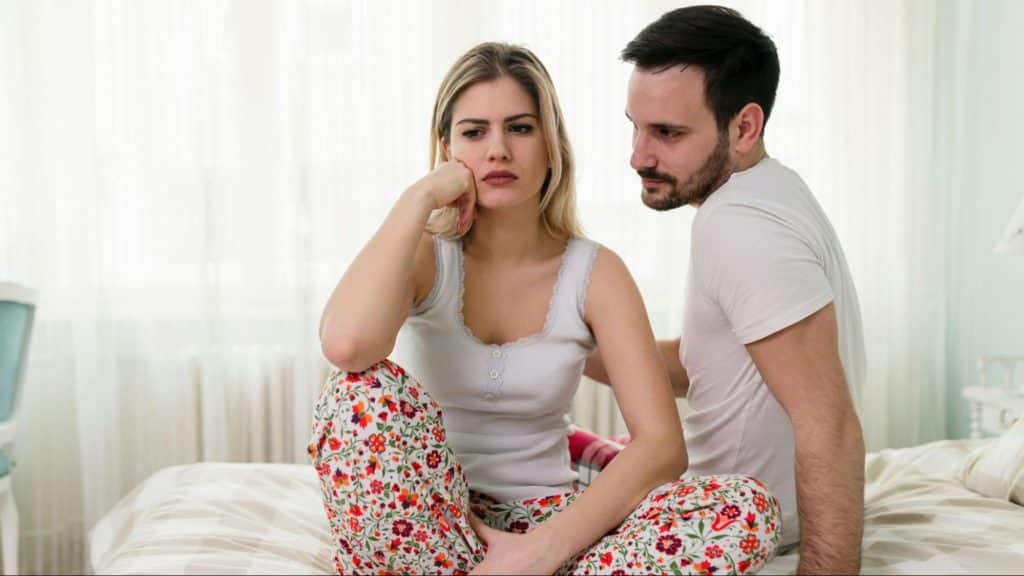A man trying to speak with woman
