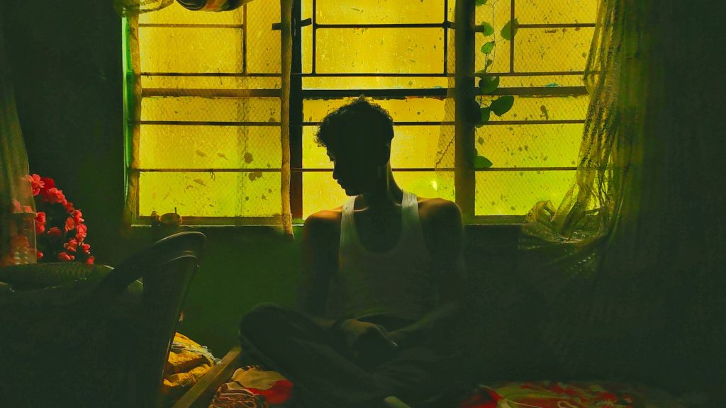 man sitting alone in a quiet room