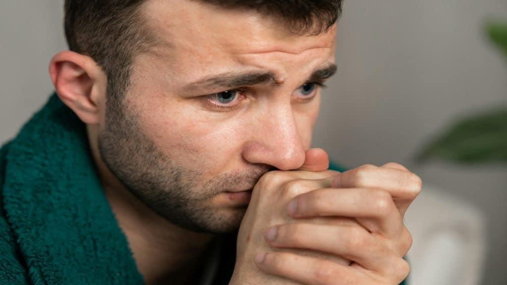 man looking concerned indoors