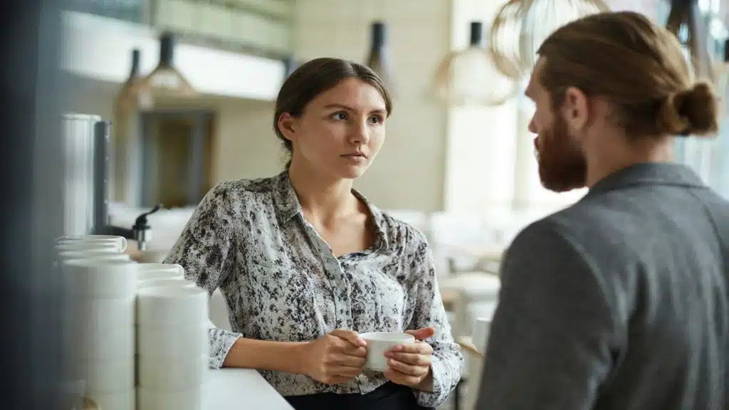 person speaking with serious expression