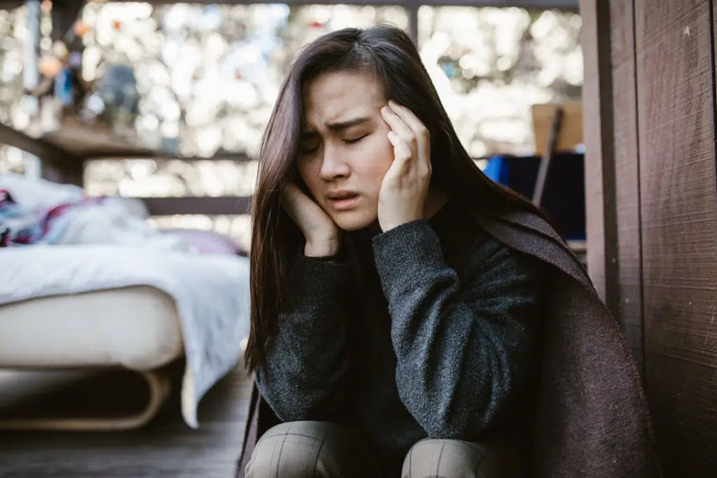 A Distressed Woman Holding her Head