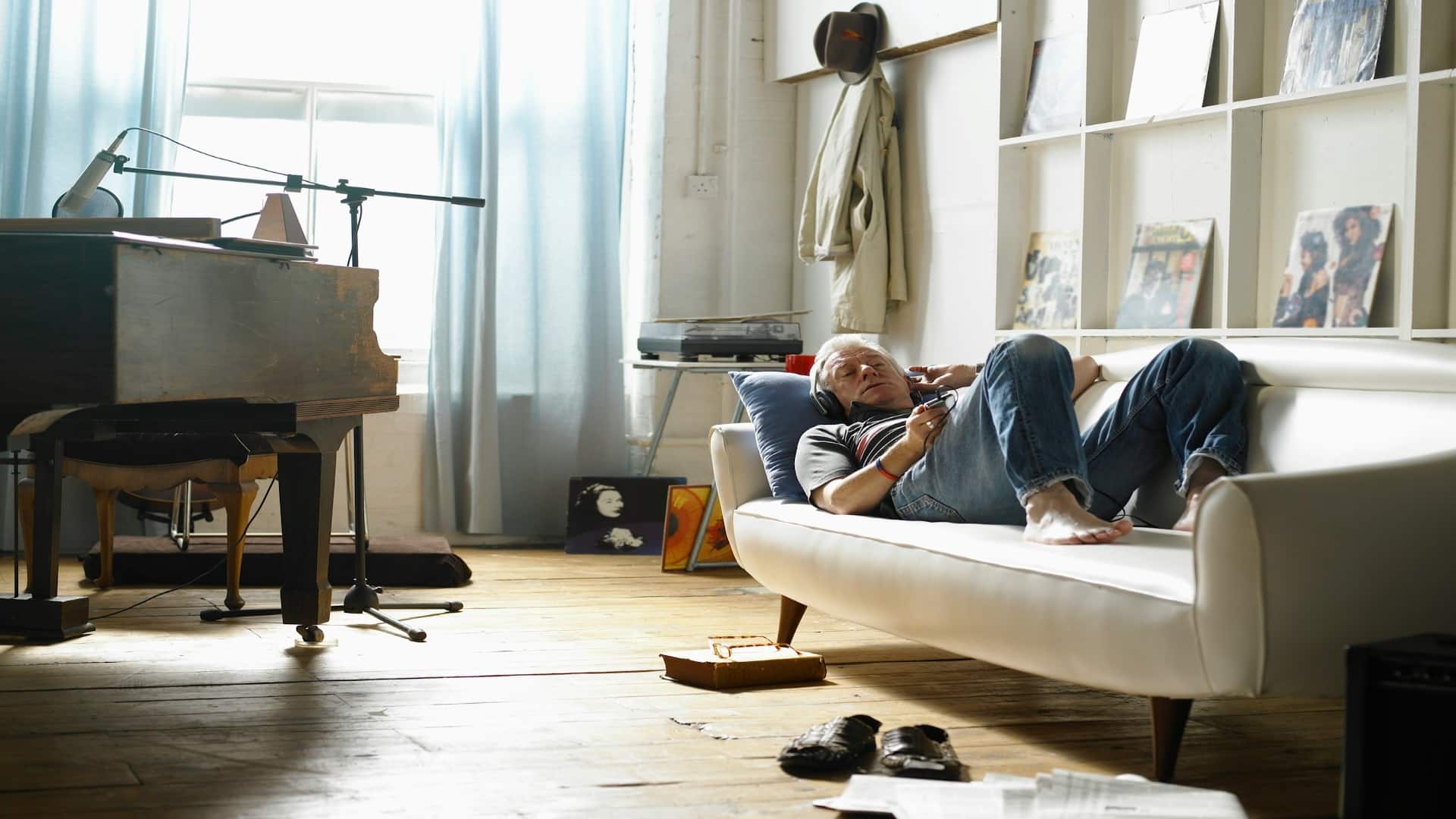 man sitting untidy indoors