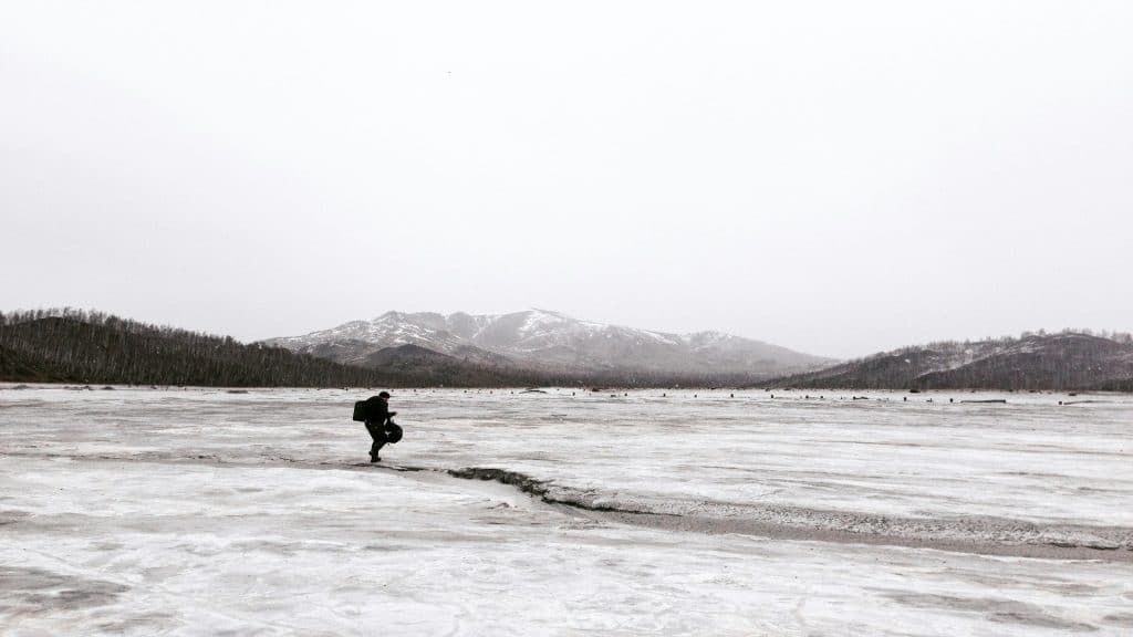 man walking alone outdoors