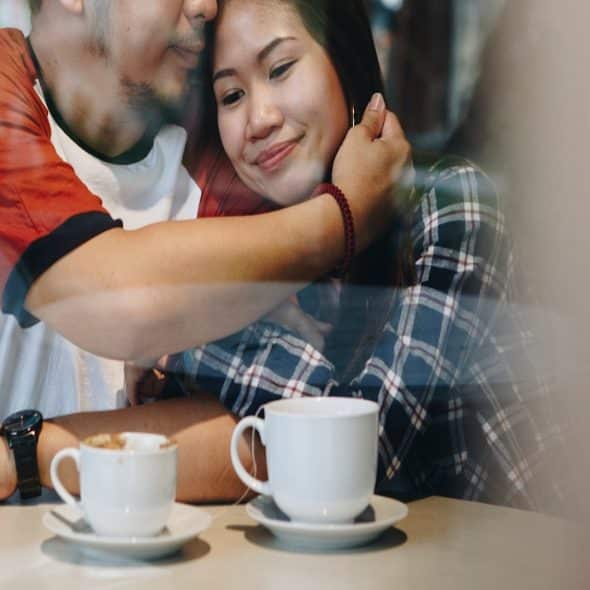 couple sitting together having calm conversation