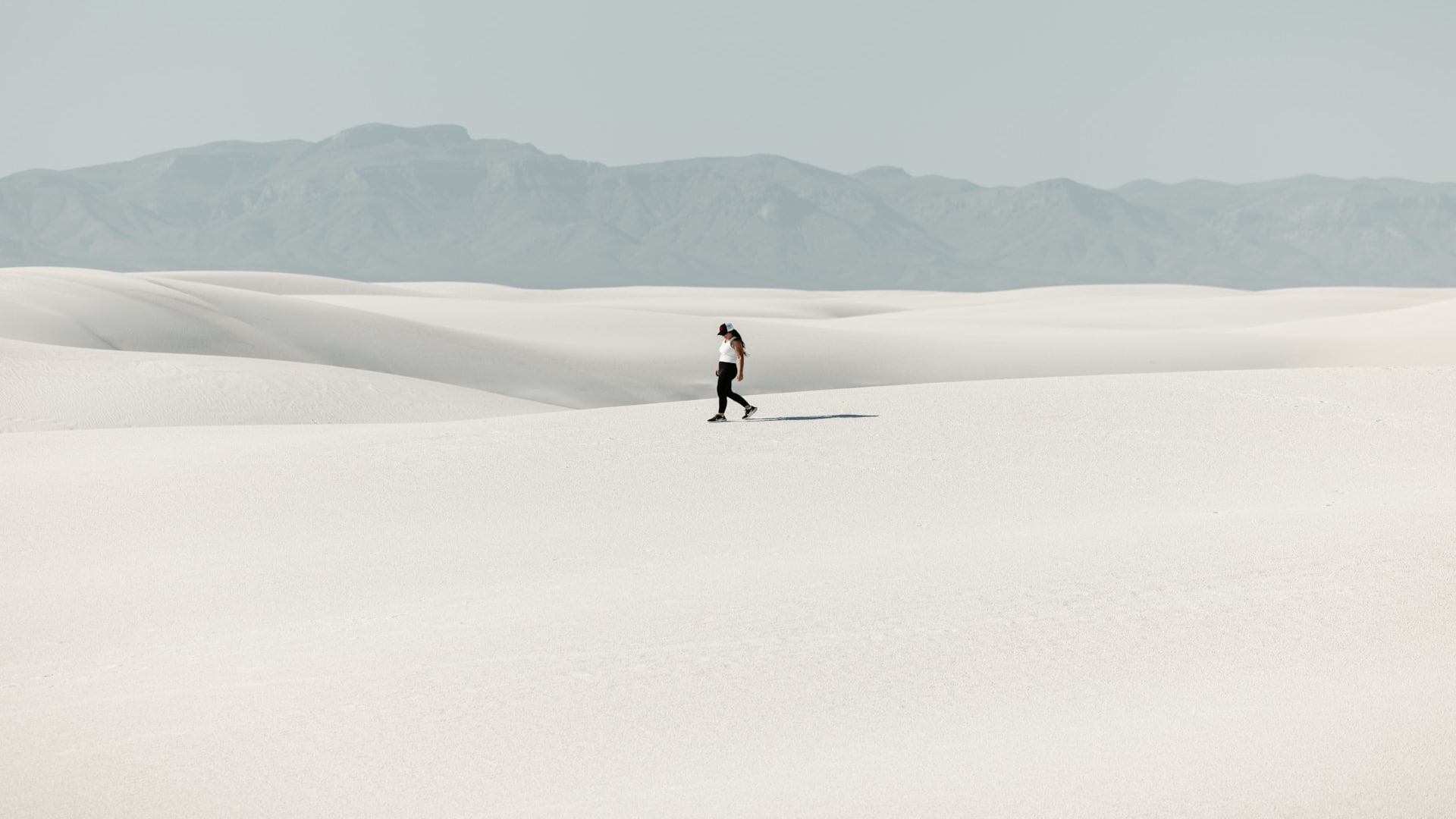 individual walking toward open horizon