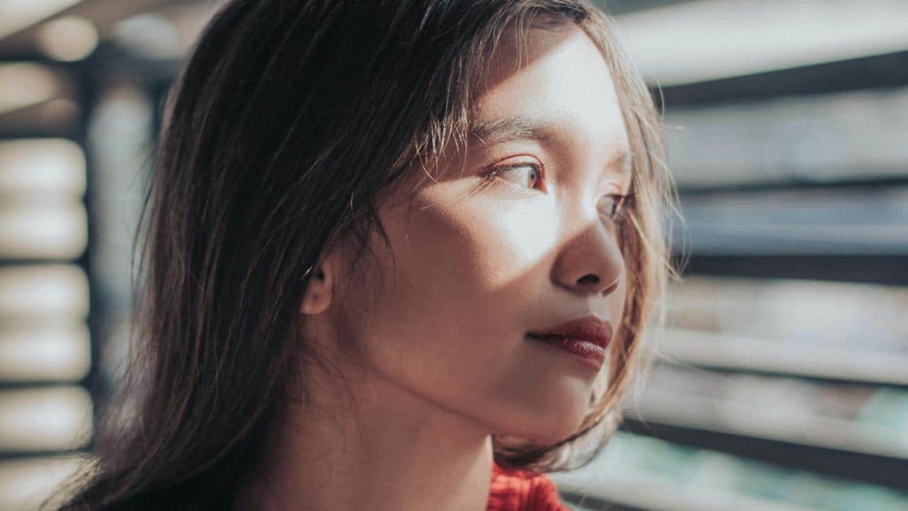 A woman gazing out a window