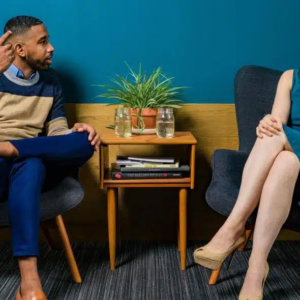 A man and woman sitting in chairs
