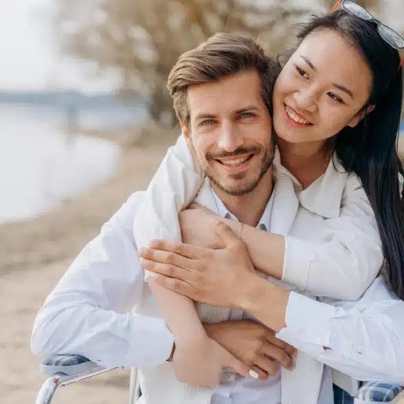 A smiling couple hugging