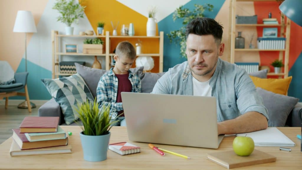 father working home office