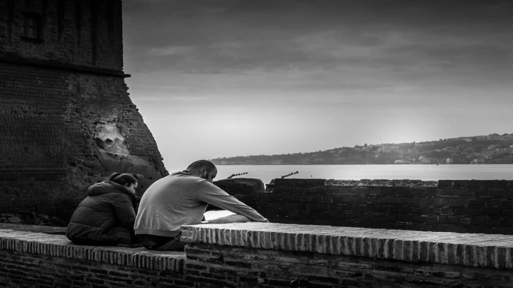 couple sitting apart during quiet moment
