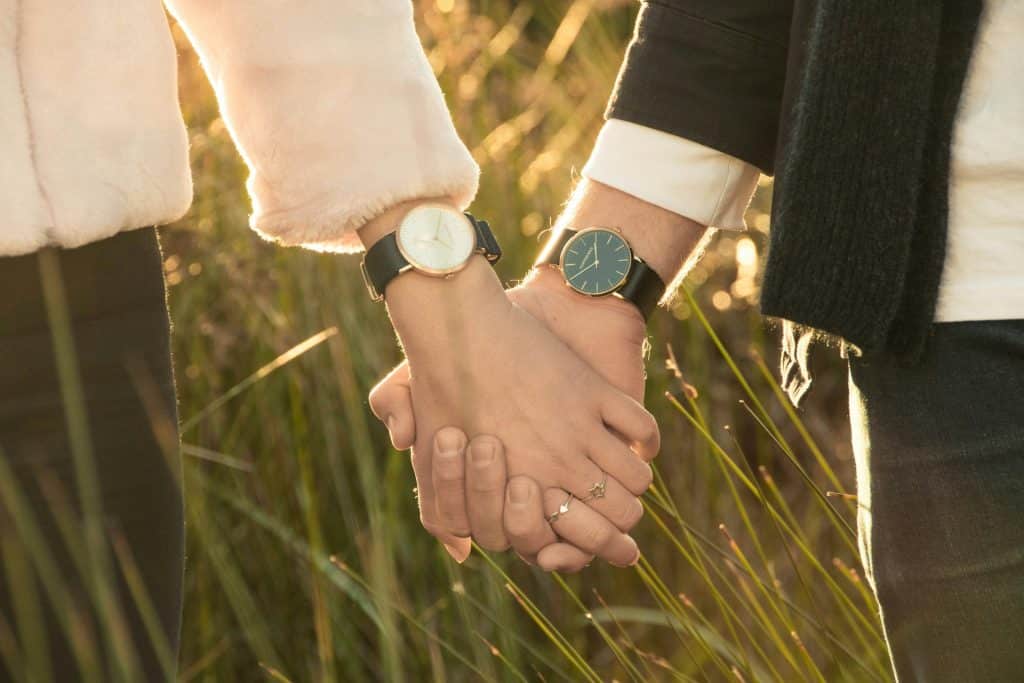 couple holding hands close