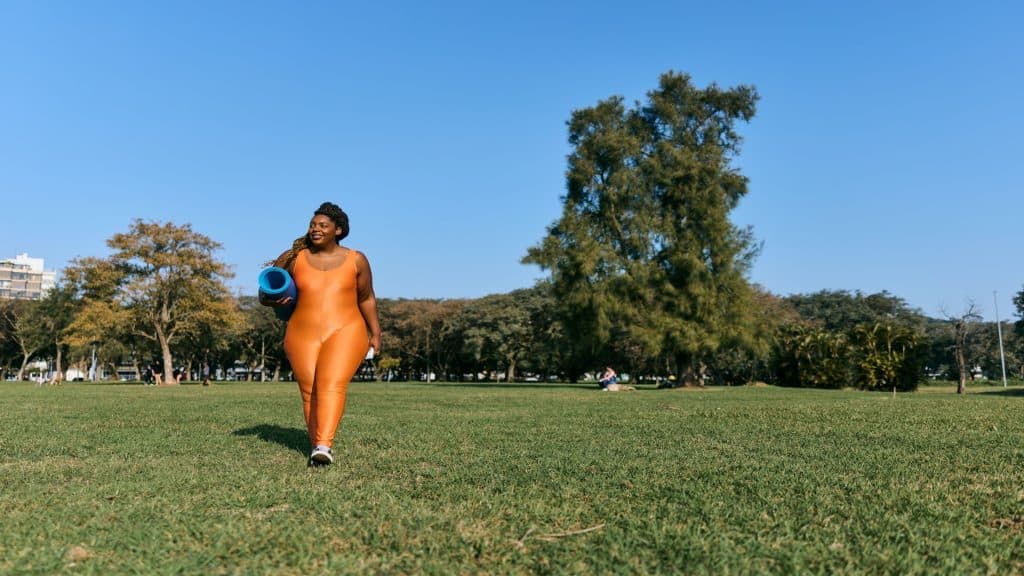 woman walking confidently outdoors