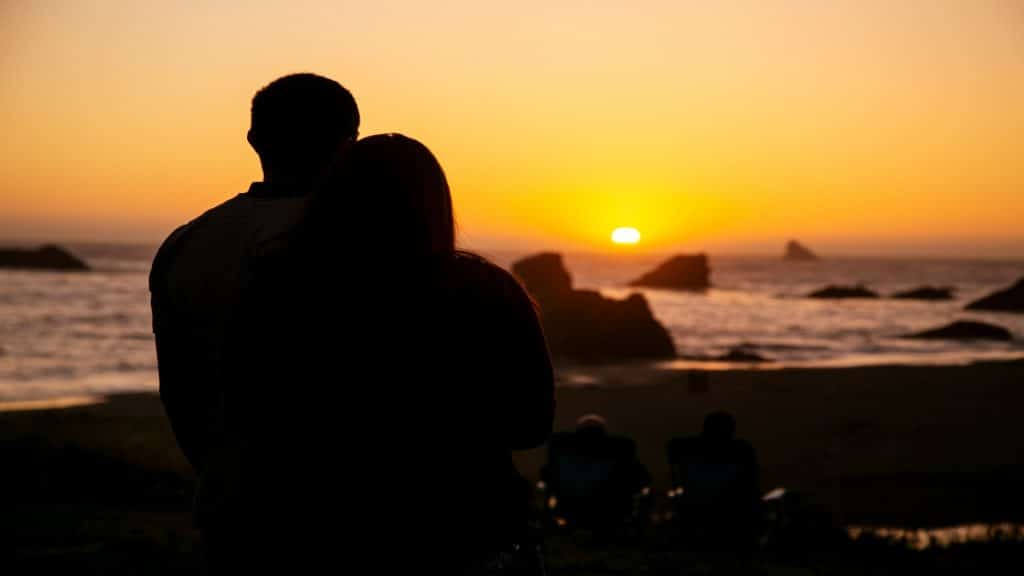 couple watching sunset together