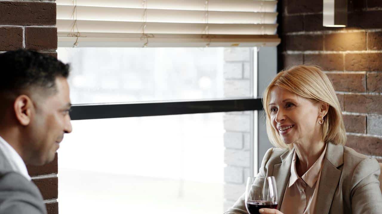 A man and woman sitting at a restaurant table
