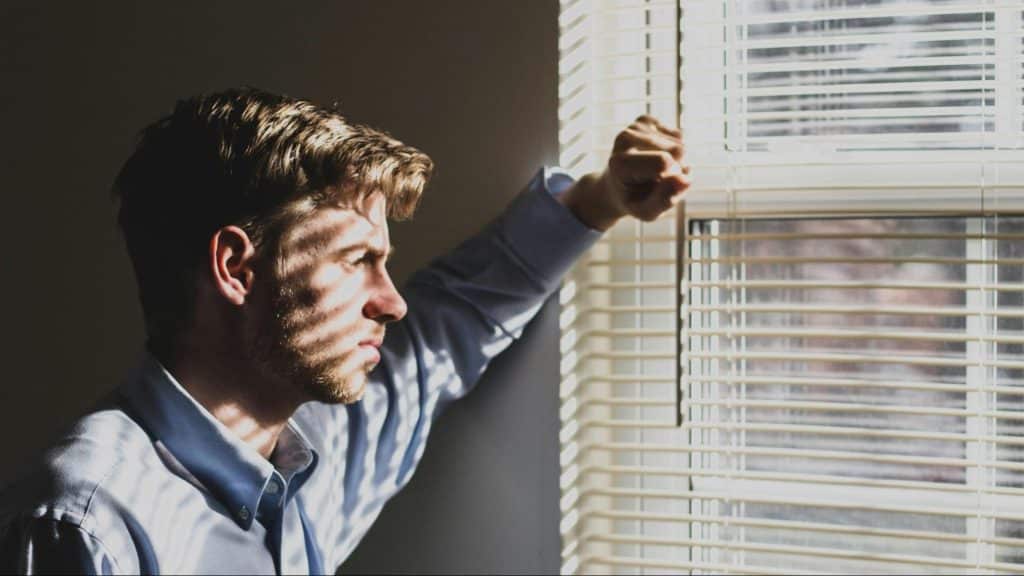 A man thinking while looking at the window