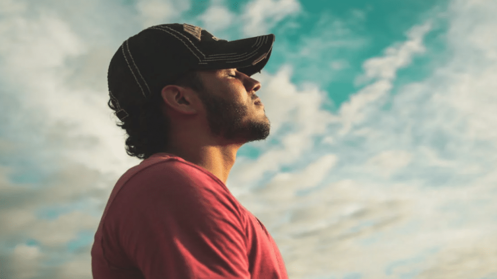 A man taking a deep breath