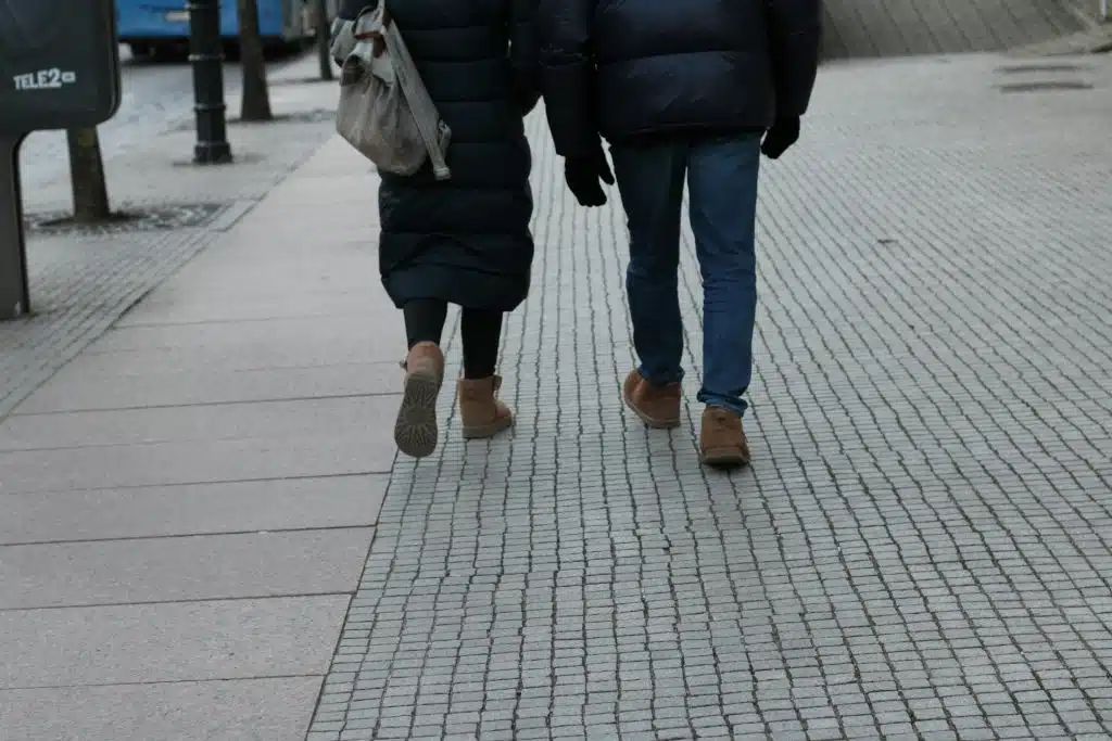 couple walking separately