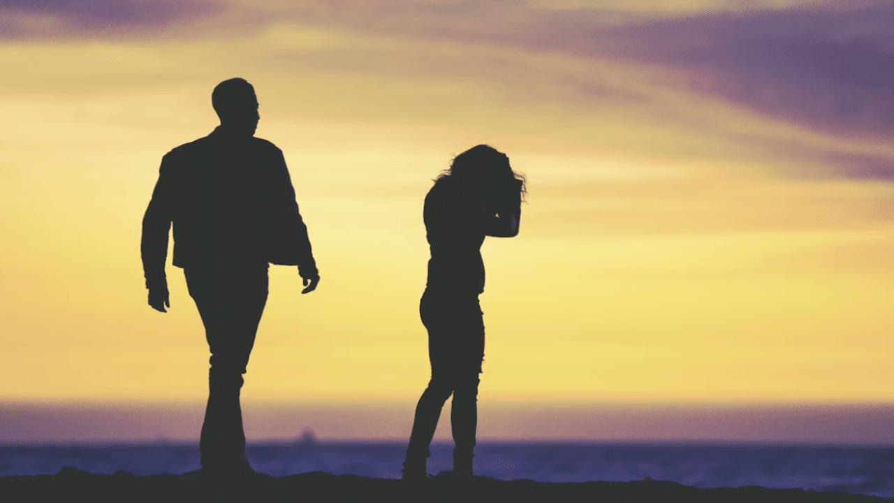 A couple fighting at dusk