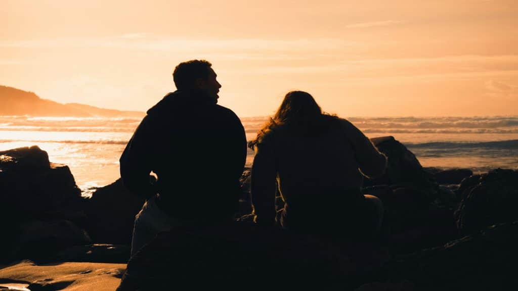 couple watching sunset together