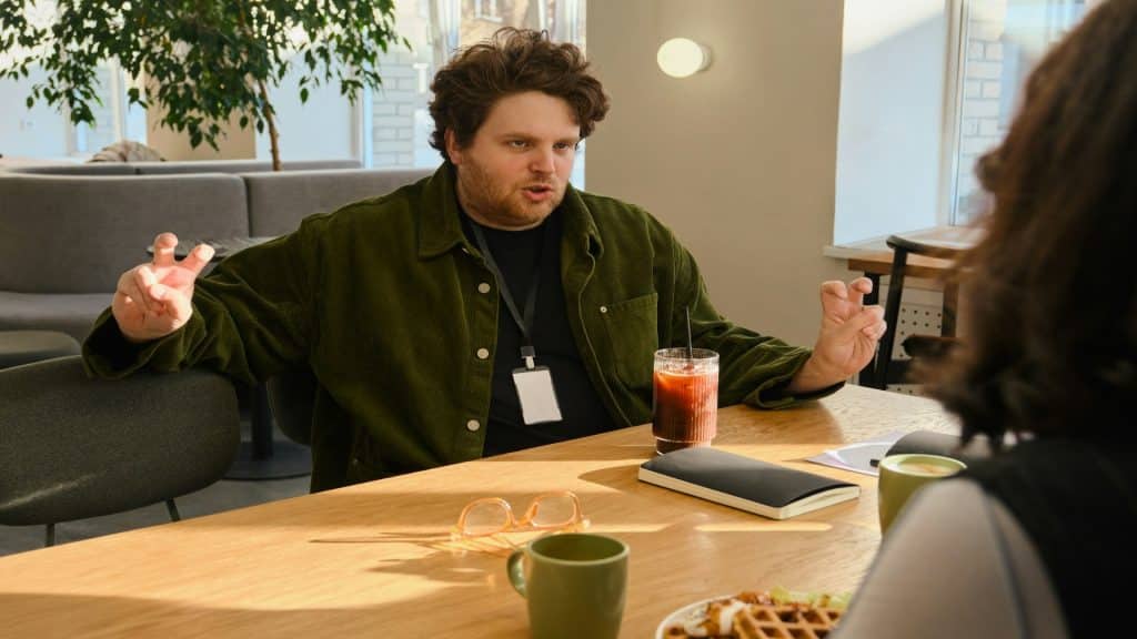 man talking during discussion