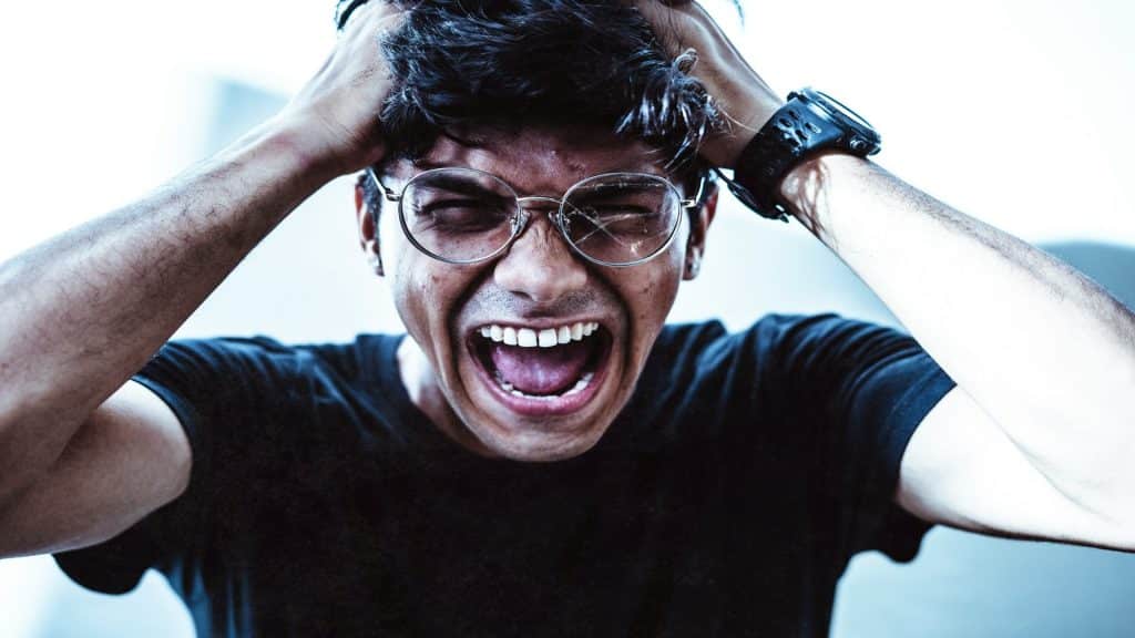 man expressing strong feelings quickly