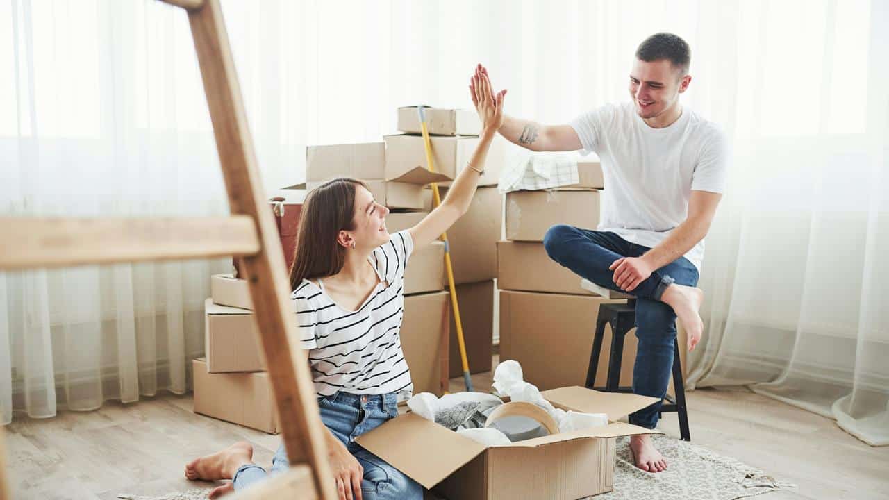 A young couple high-fiving