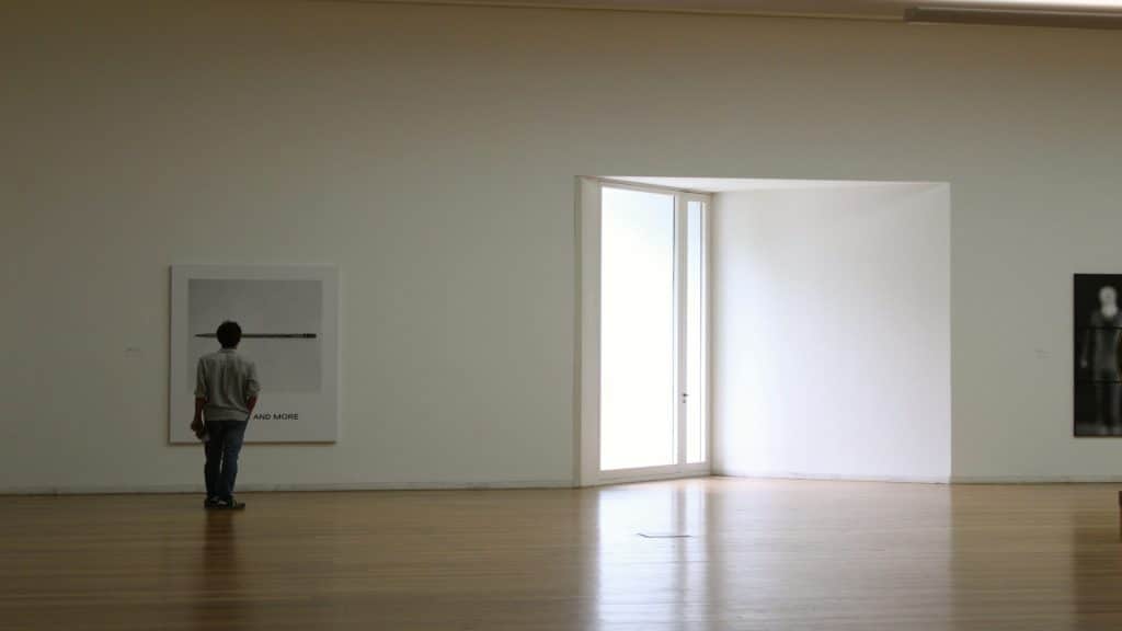 man standing alone indoors
